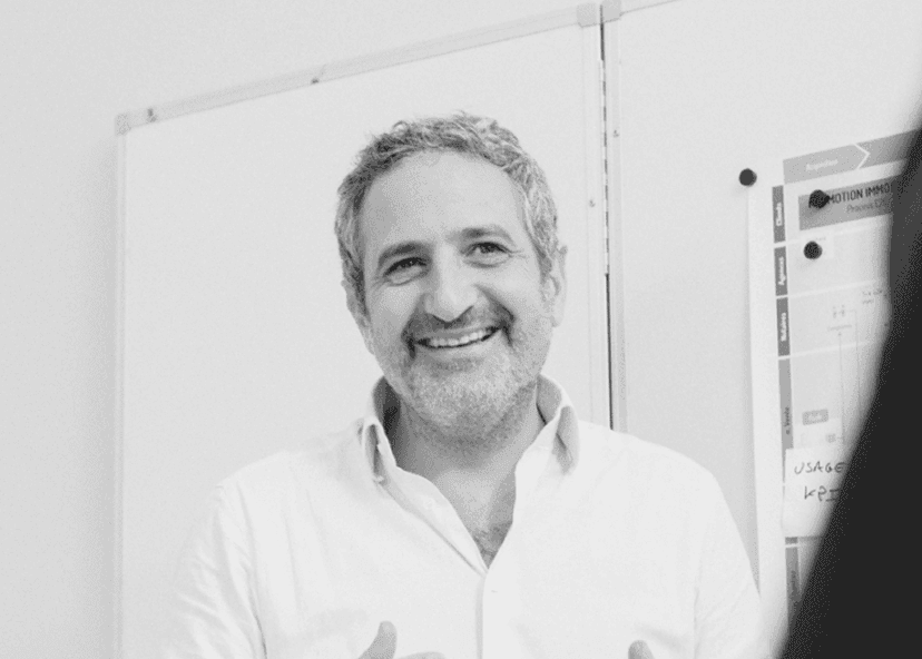 Arik Azoulay coaching a client at a whiteboard