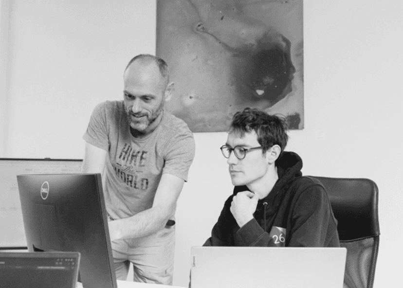 Two 26lights developers pairing on a screen