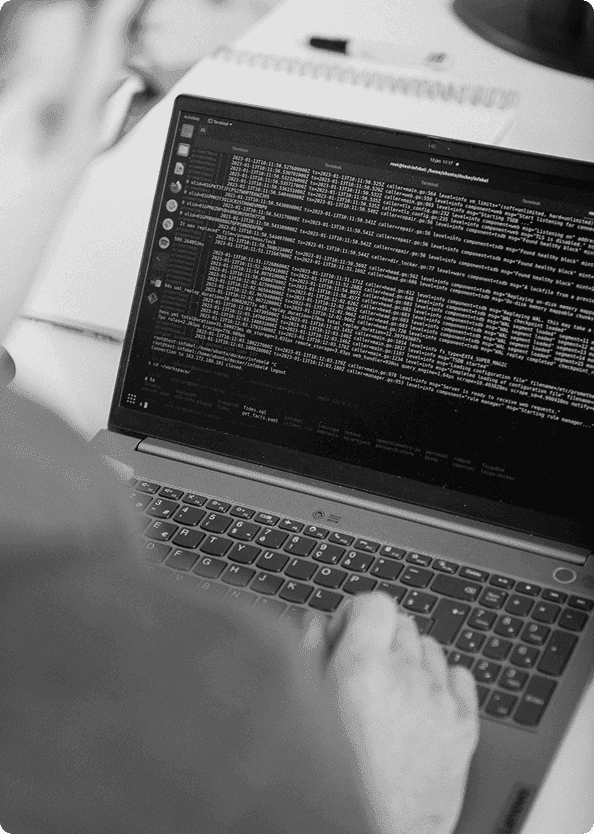 A 26lights developer at work on a laptop